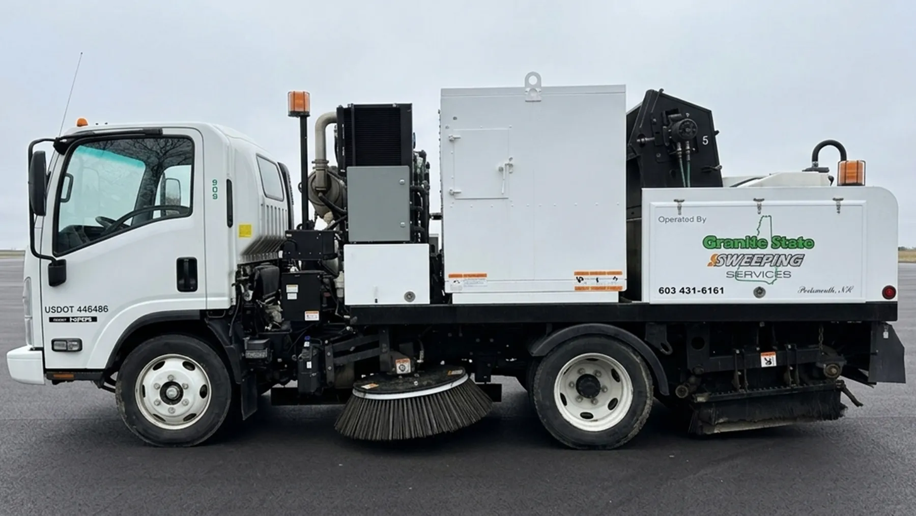 Granite State Sweeping mechanical street sweeper showing its gutter and rear brooms